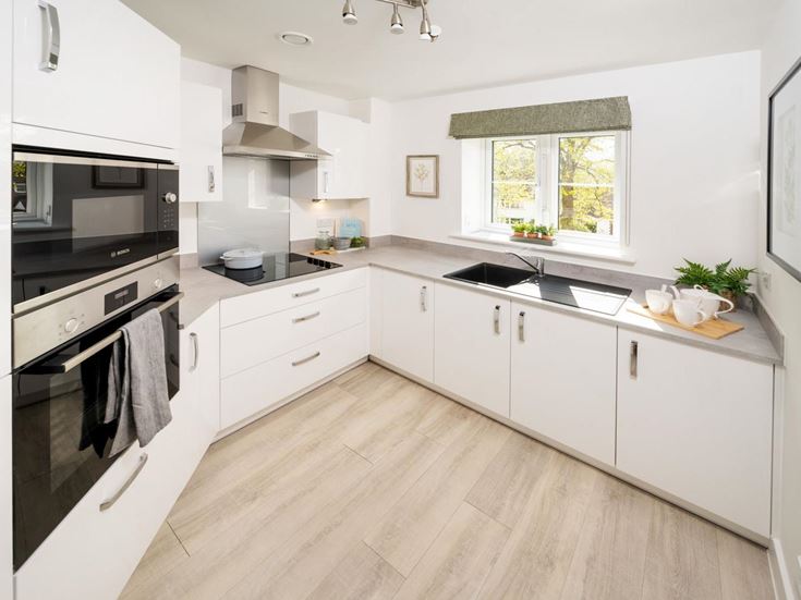 a kitchen with white cabinets