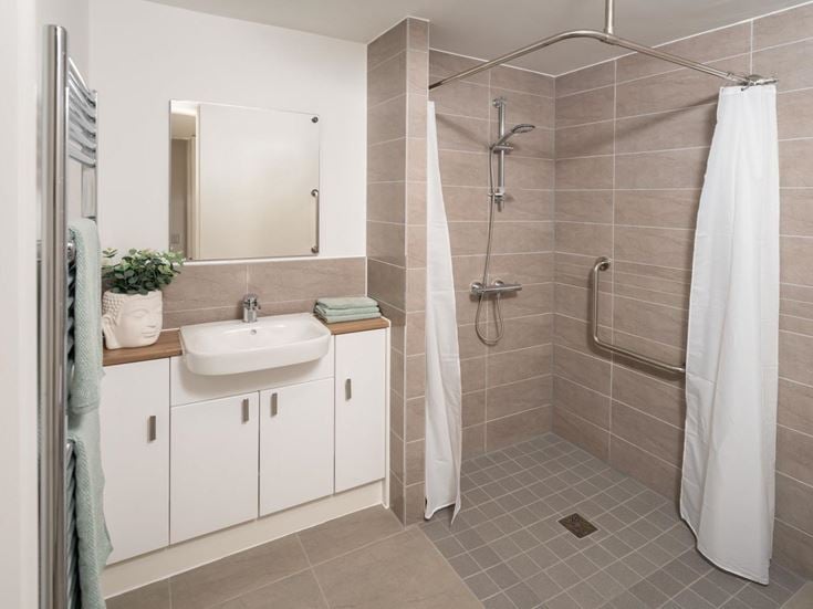 a bathroom with a shower and sink