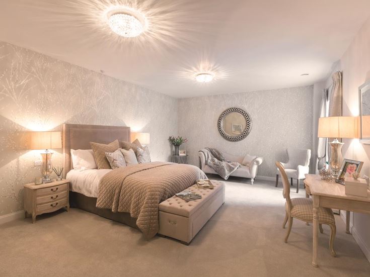 a bedroom with a bed and a desk
