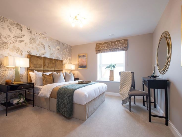 a bedroom with a bed and a chair