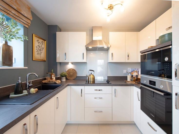a kitchen with white cabinets