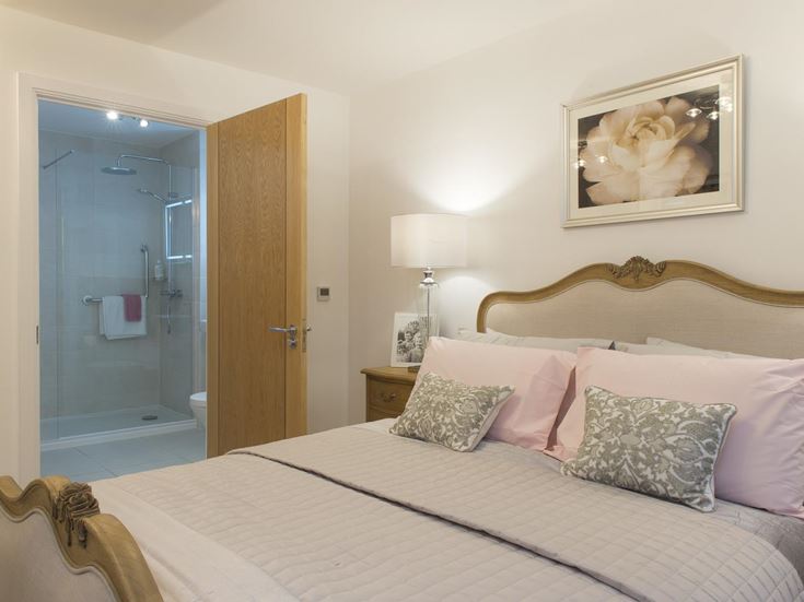 a bed with a white bed spread