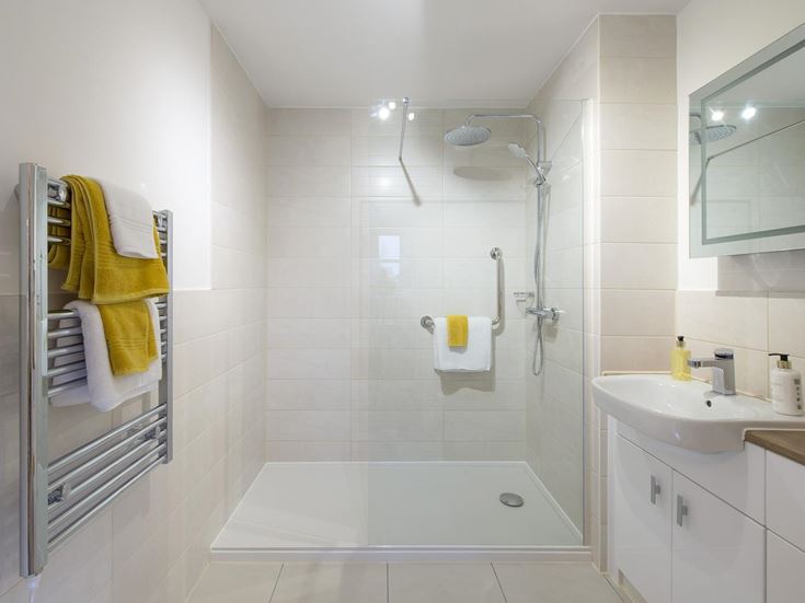 a bathroom with a shower and sink