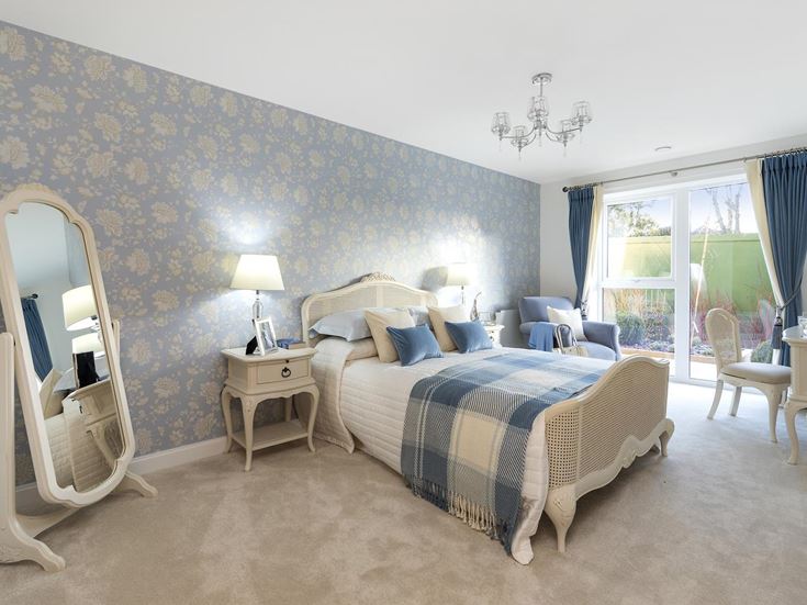 a bedroom with a bed and a mirror