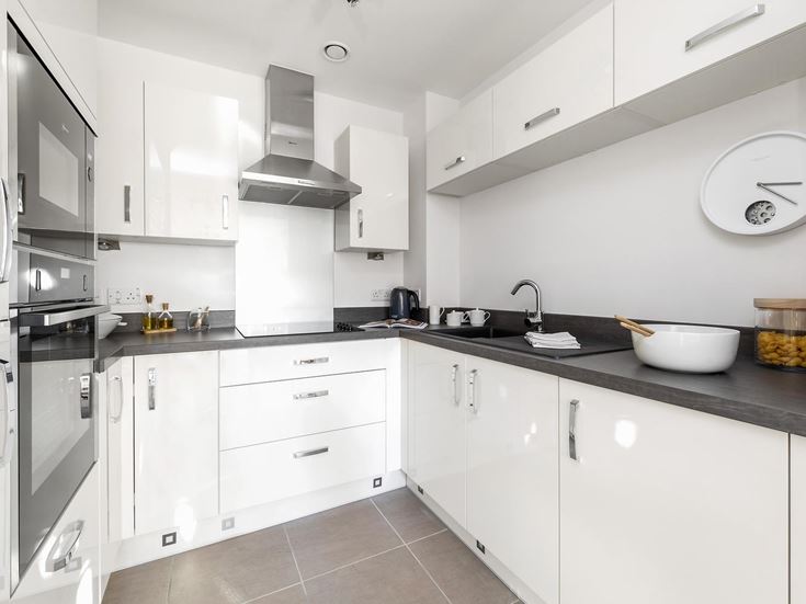 a kitchen with white cabinets