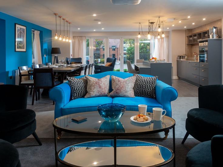 a living room with a blue couch