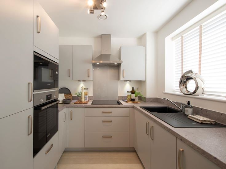 a kitchen with white cabinets