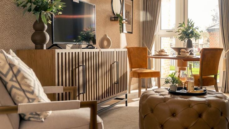 a living room with a couch and chairs