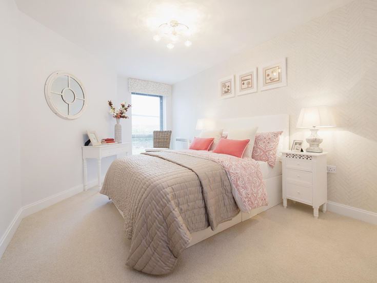 a bedroom with a bed and a mirror
