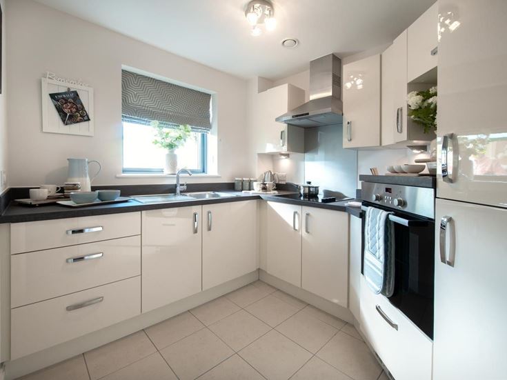 a kitchen with white cabinets