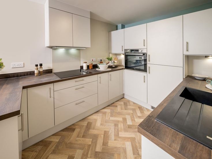a kitchen with white cabinets