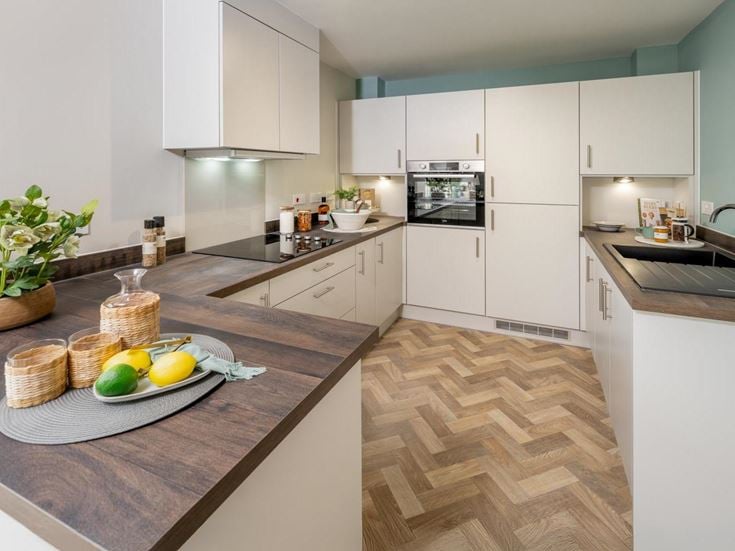 a kitchen with a marble counter top