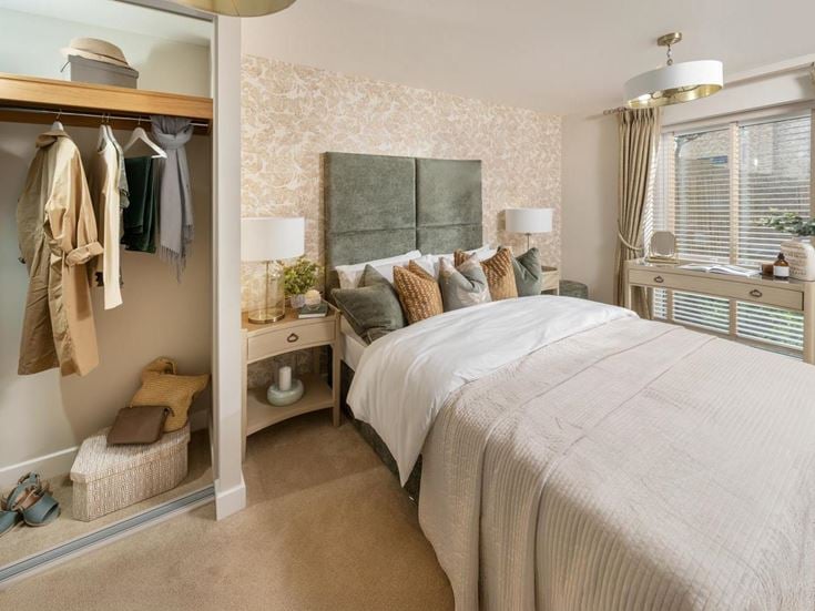 a bedroom with a bed and a chair