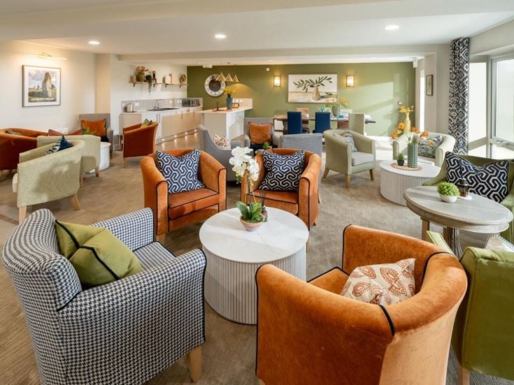 a large living room with a large dining room and a large window