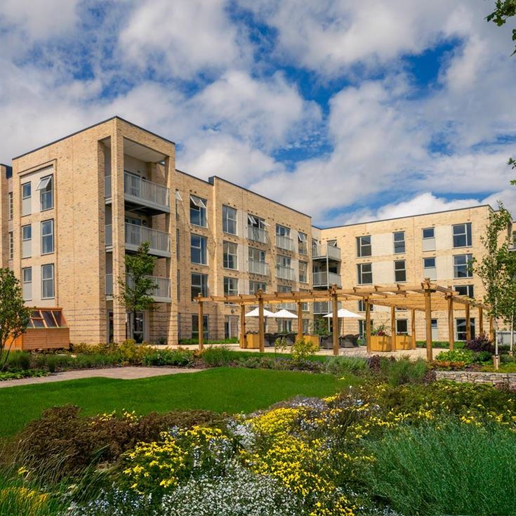 a building with a garden in front of it