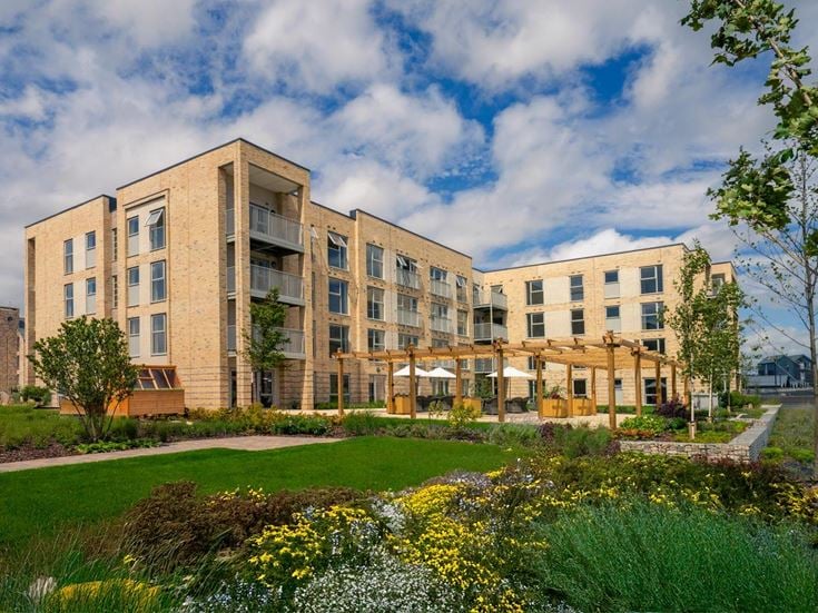 a building with a garden in front of it
