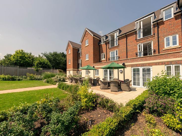 a large brick house with a garden