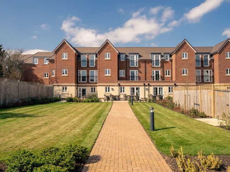 a brick building with a brick walkway