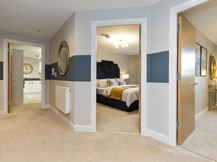 a bedroom with a large mirror