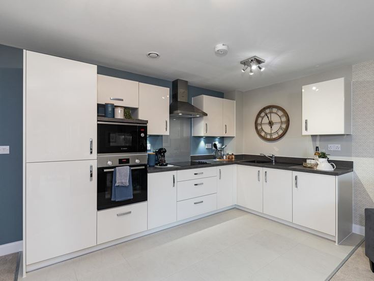a kitchen with white cabinets