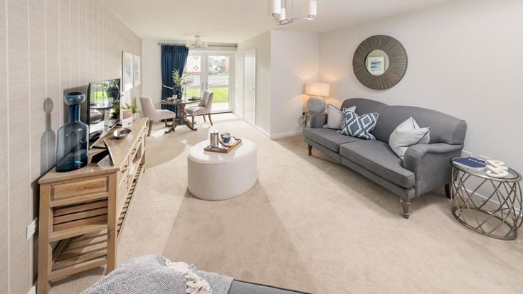a living room with a couch and a table