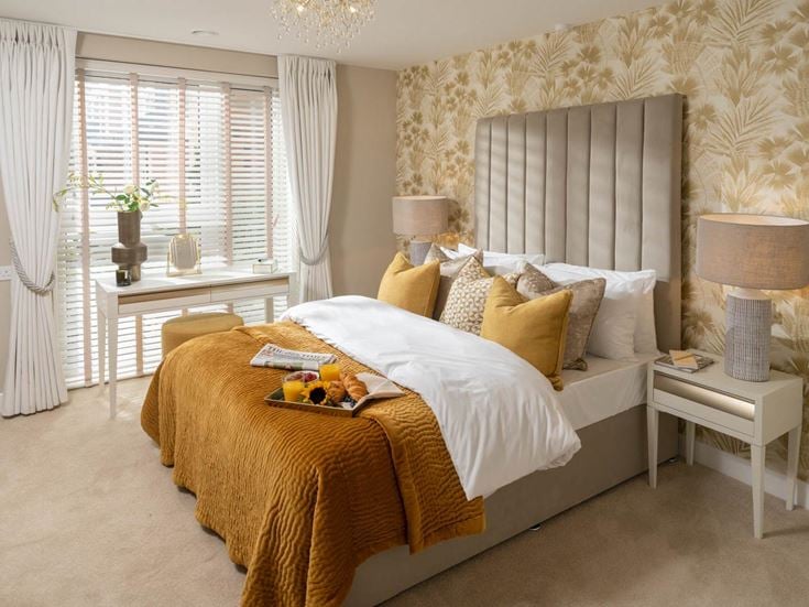 a bedroom with a bed and a table