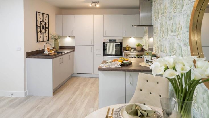a kitchen with white cabinets
