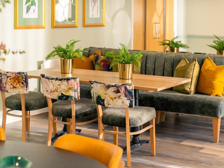 a living room with a couch and chairs