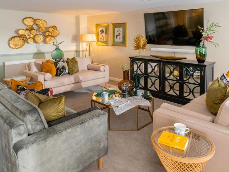 a living room with a tv and couches