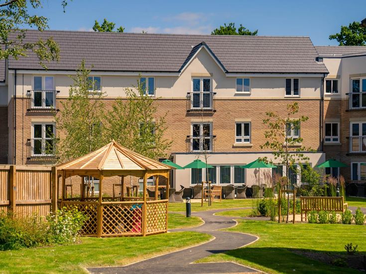 a large house with a small gazebo in the front