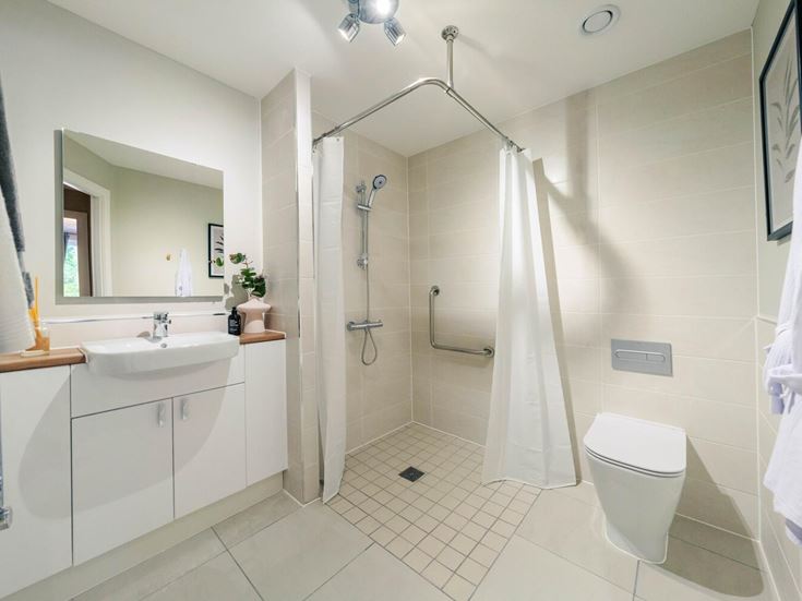 a bathroom with a shower and toilet