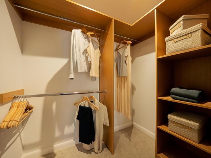 a closet with clothes