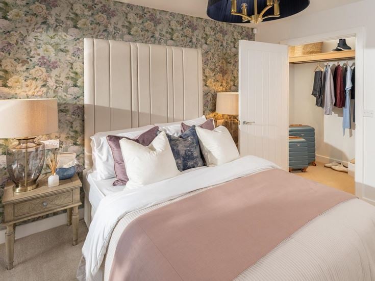 a bed with a white bed spread