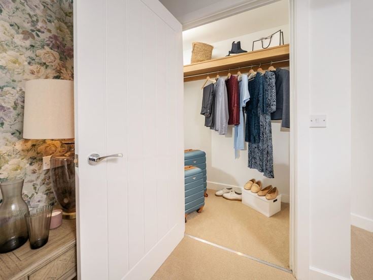 a closet with clothes