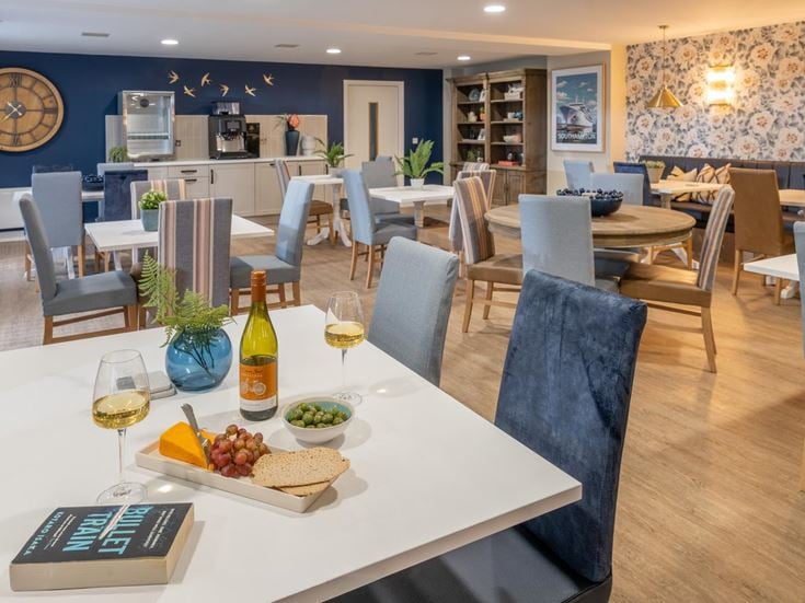 a dining room with a table and chairs