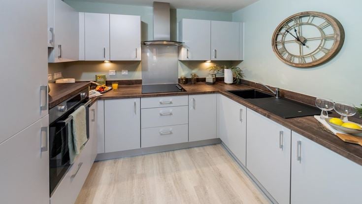 a kitchen with white cabinets