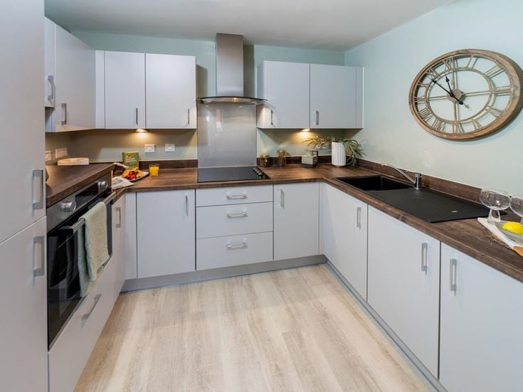 a kitchen with white cabinets