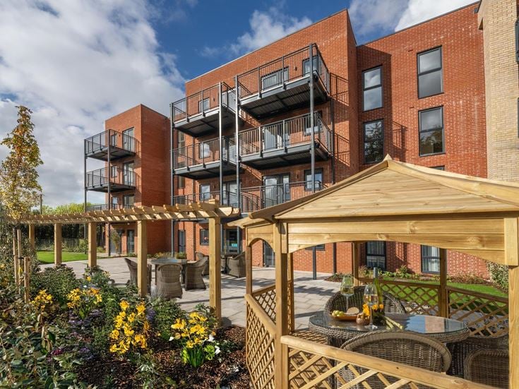 a building with a garden in front of it