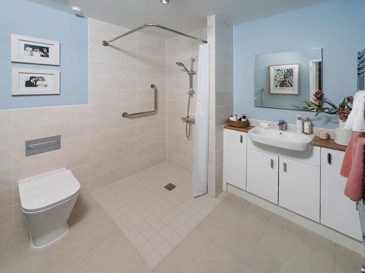 a bathroom with a shower and toilet