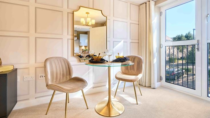 a dining room with a table and chairs