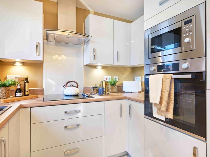 a kitchen with white cabinets