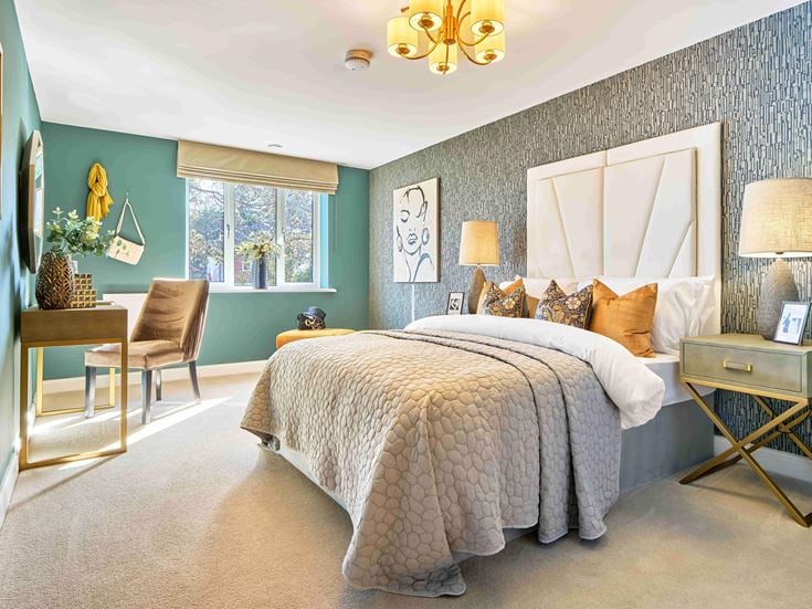 a bedroom with a bed and a chair