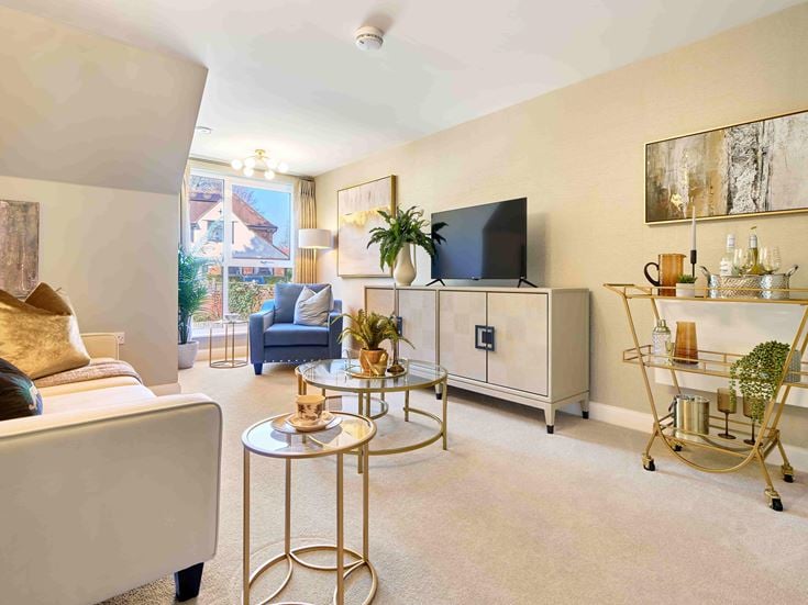 a living room with a tv and furniture