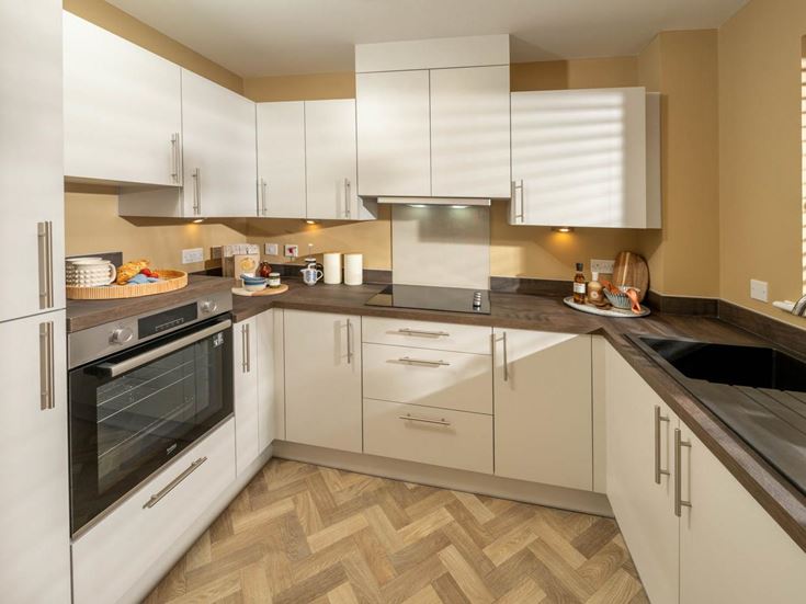 a kitchen with white cabinets