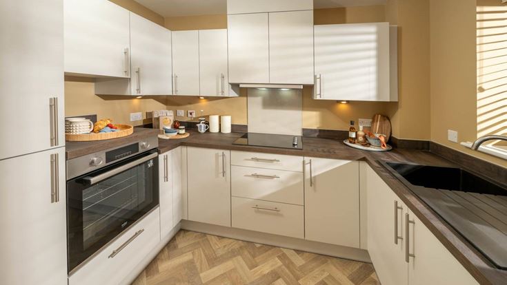 a kitchen with white cabinets