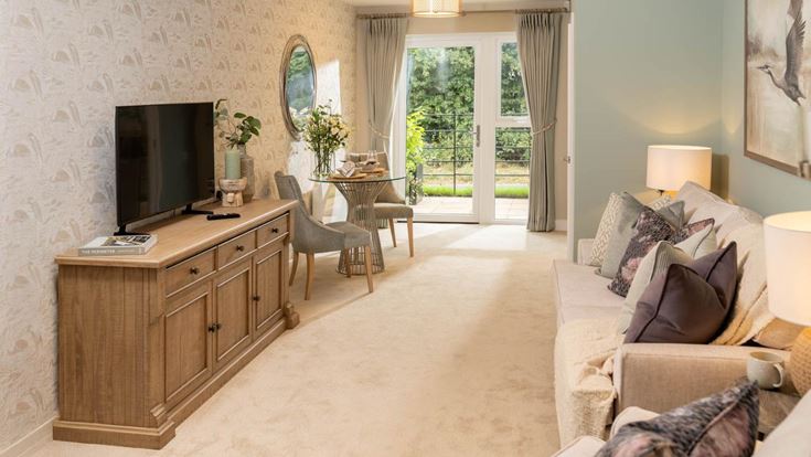 a living room with a couch and a tv