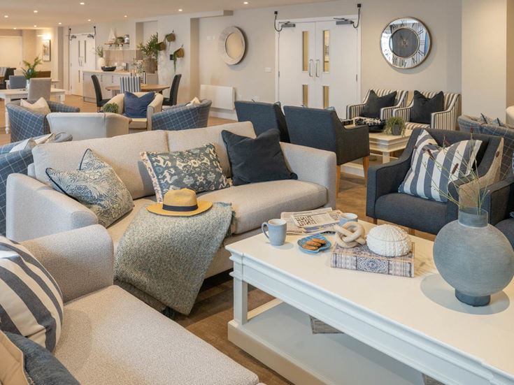 a living room with a couch and chairs