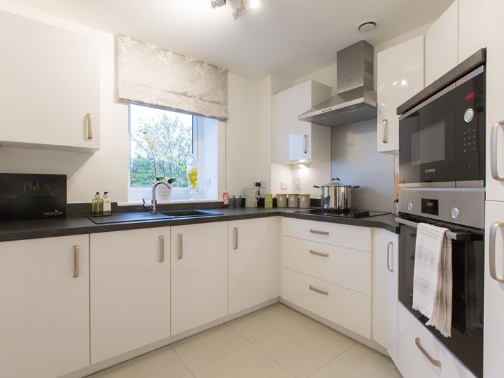 a kitchen with white cabinets