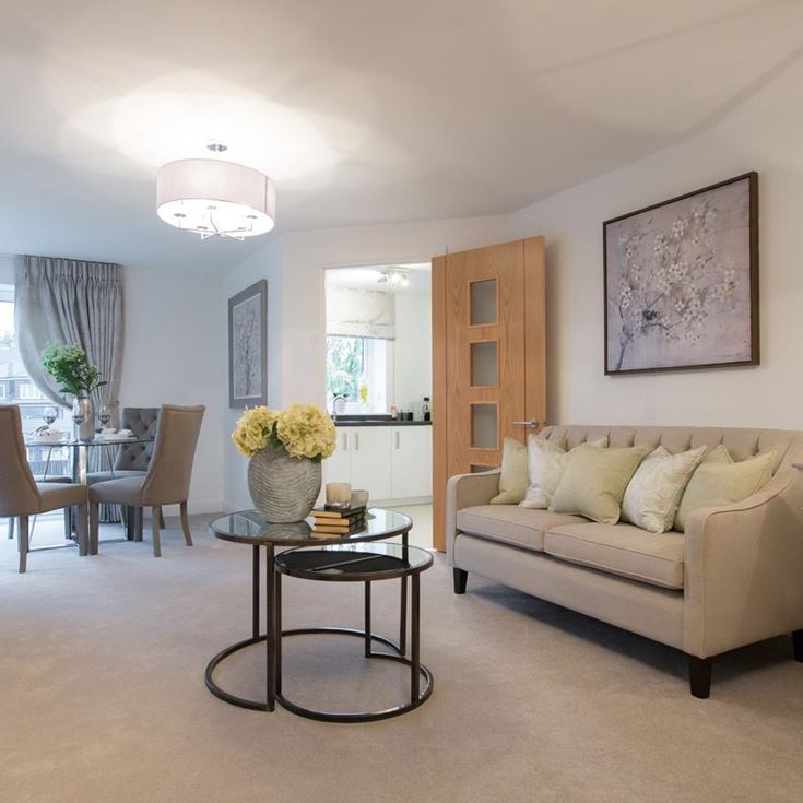a living room with a couch and a table