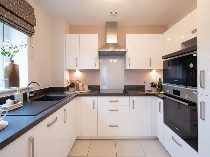 a kitchen with white cabinets